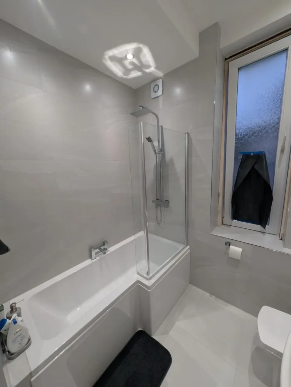 Light bathroom with a fitted bath